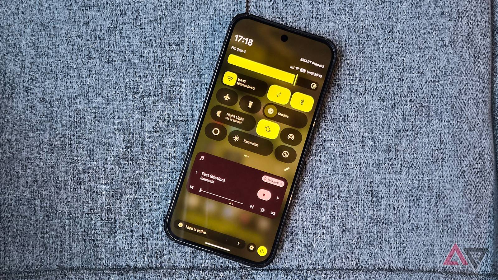 Google Pixel 9 Pro XL smartphone and its quick settings panel with media player