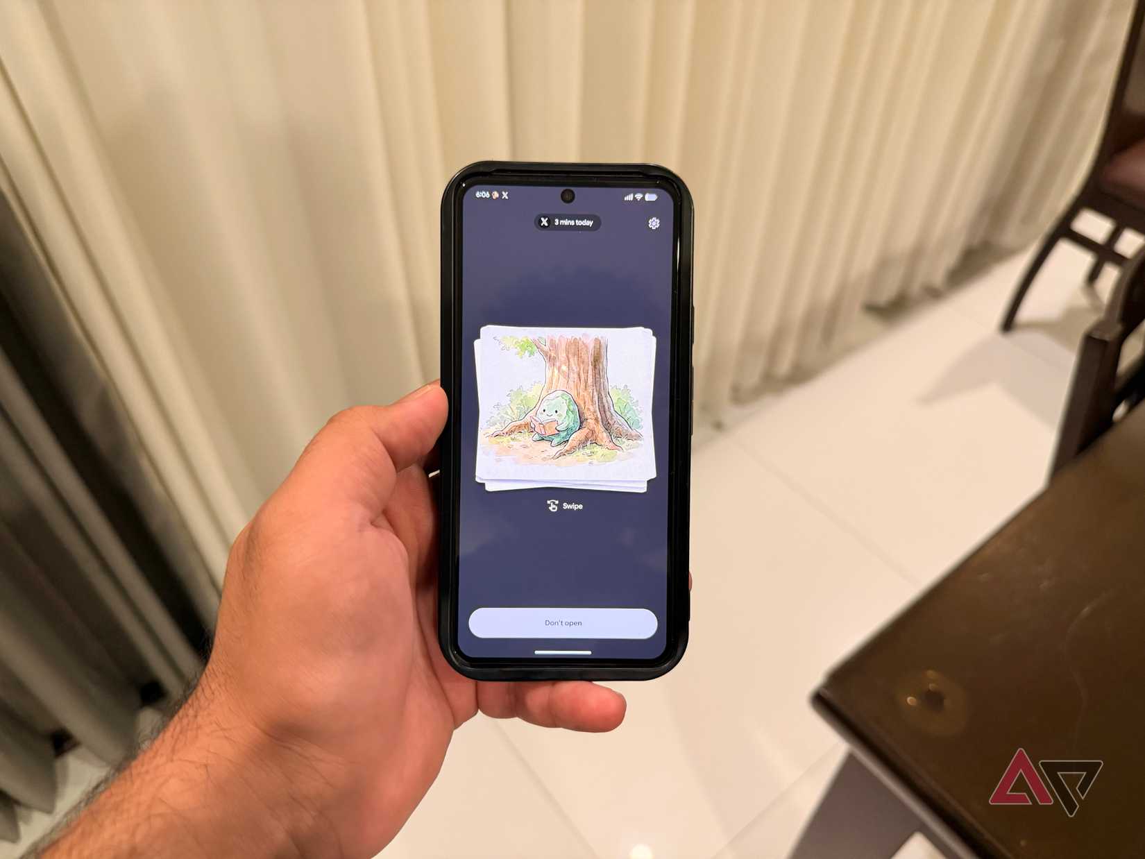 Hand holding a Pixel phone running Android 17 Pause Point