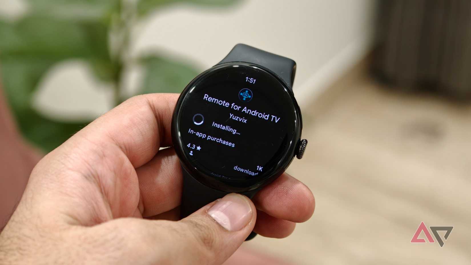 Google Pixel Watch displaying the Remote for Android TV app installing from the Google Play Store