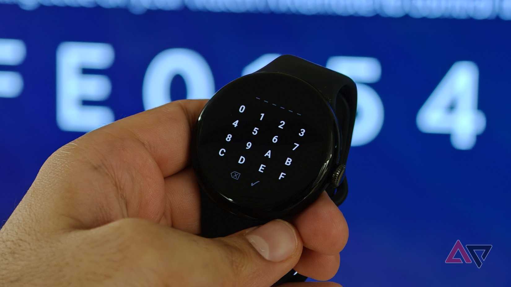 Google Pixel Watch displaying a numeric keypad for entering a code while connecting to an Android TV