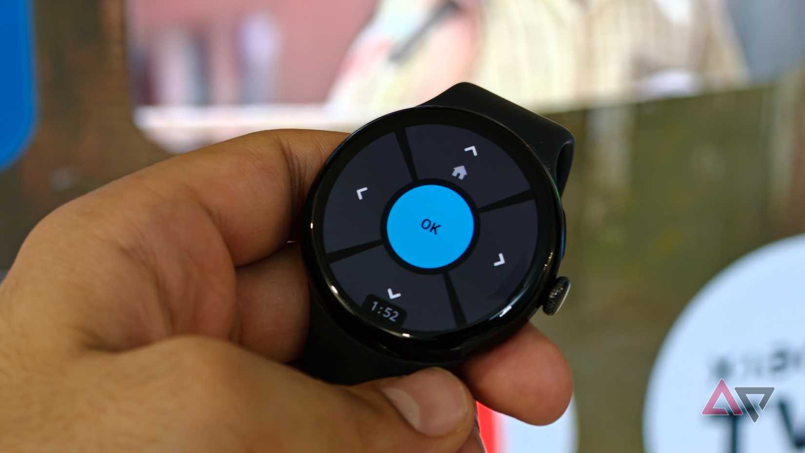 Google Pixel Watch running the Remote for Android TV app with its circular navigation pad and OK button