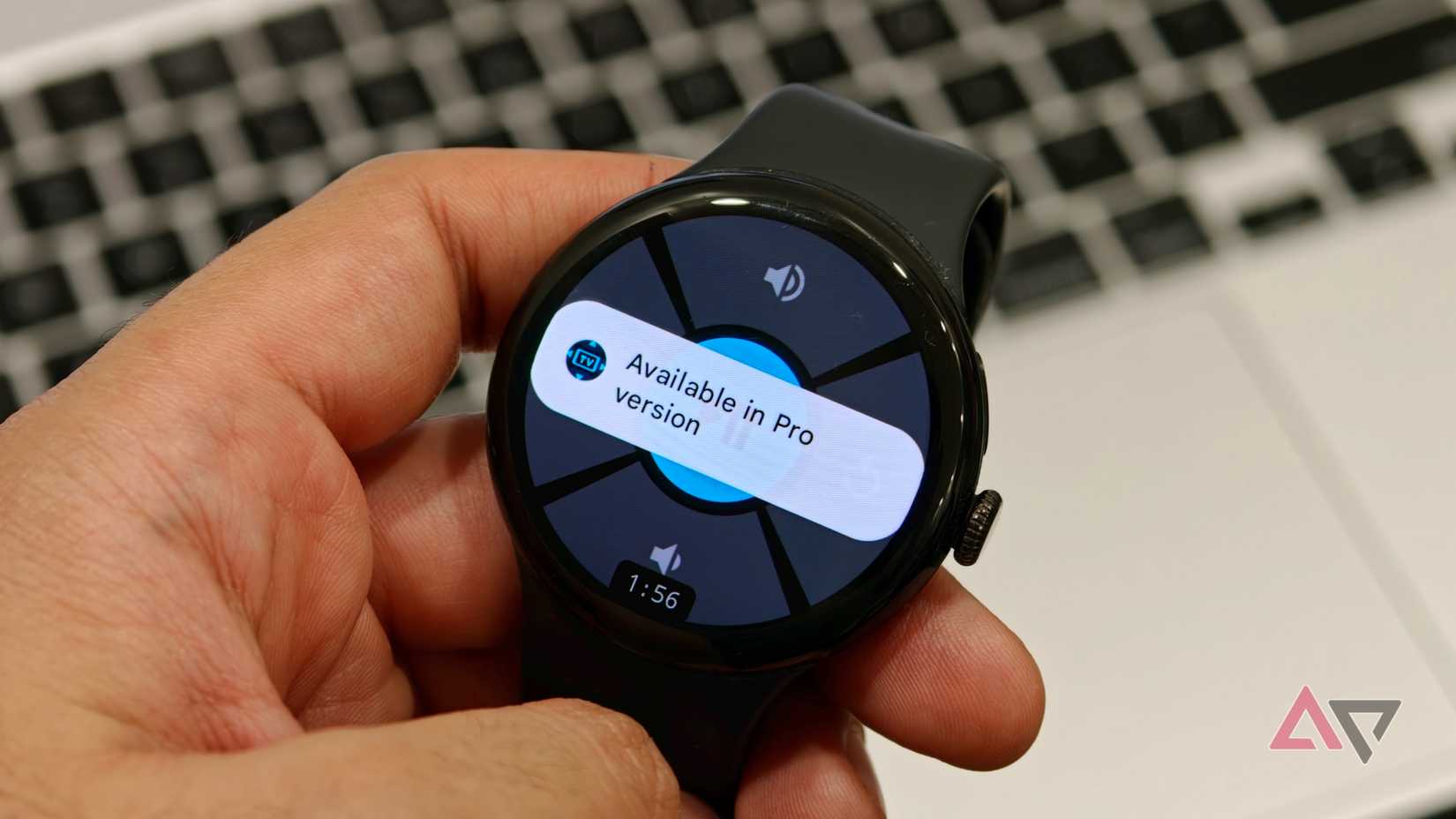 Google Pixel Watch showing the Remote for Android TV app with volume controls and an "Available in Pro version" message
