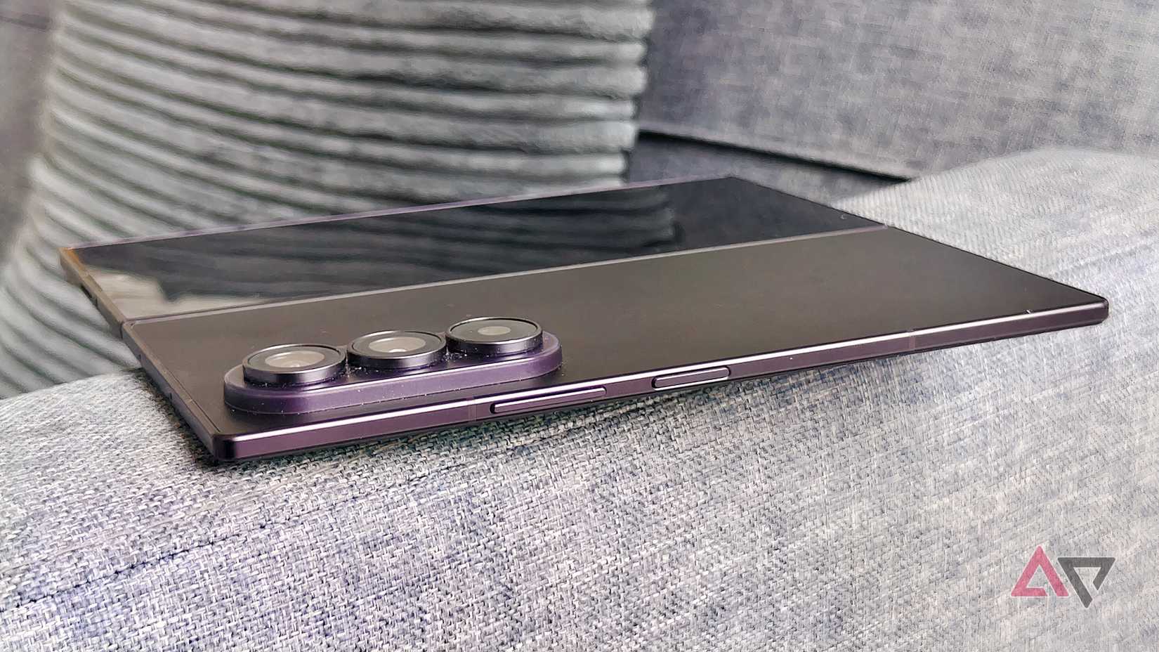 The Samsung Galaxy Z Fold 8, unfolded on the arm of a sofa.
