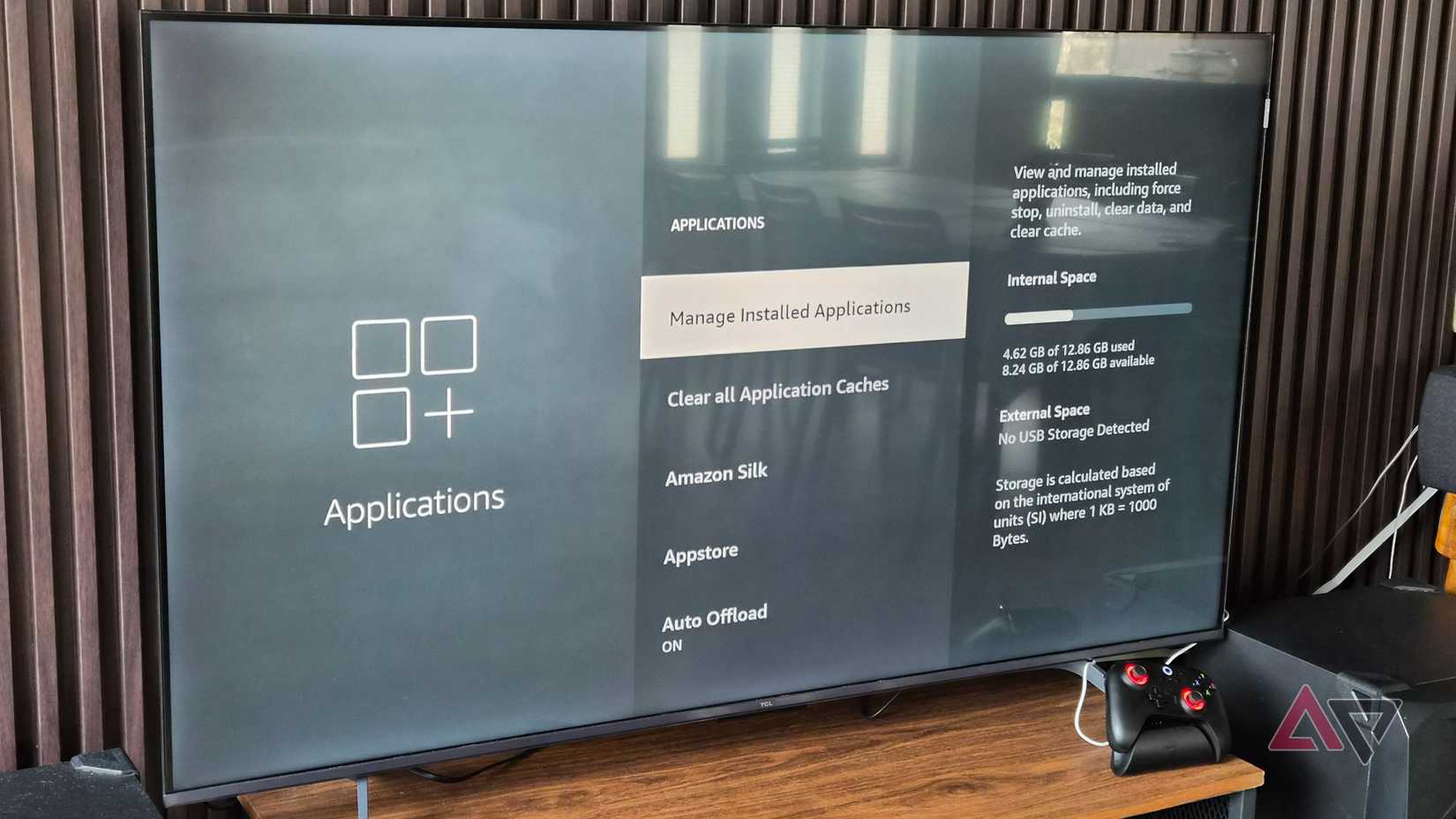 TCL Smart 4K TV with Amazon Fire TV OS and a gaming controller