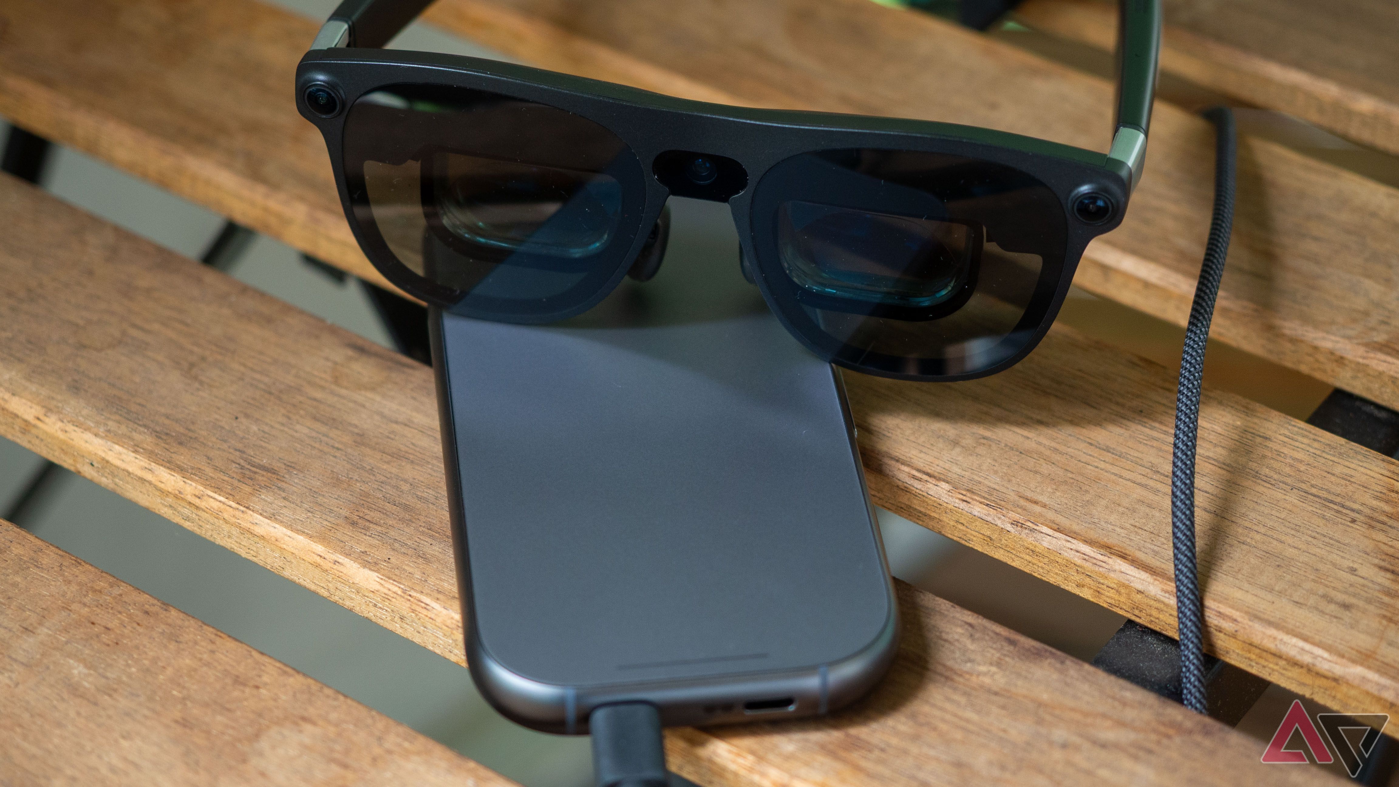 Xreal Aura glasses sitting on top of the main unit
