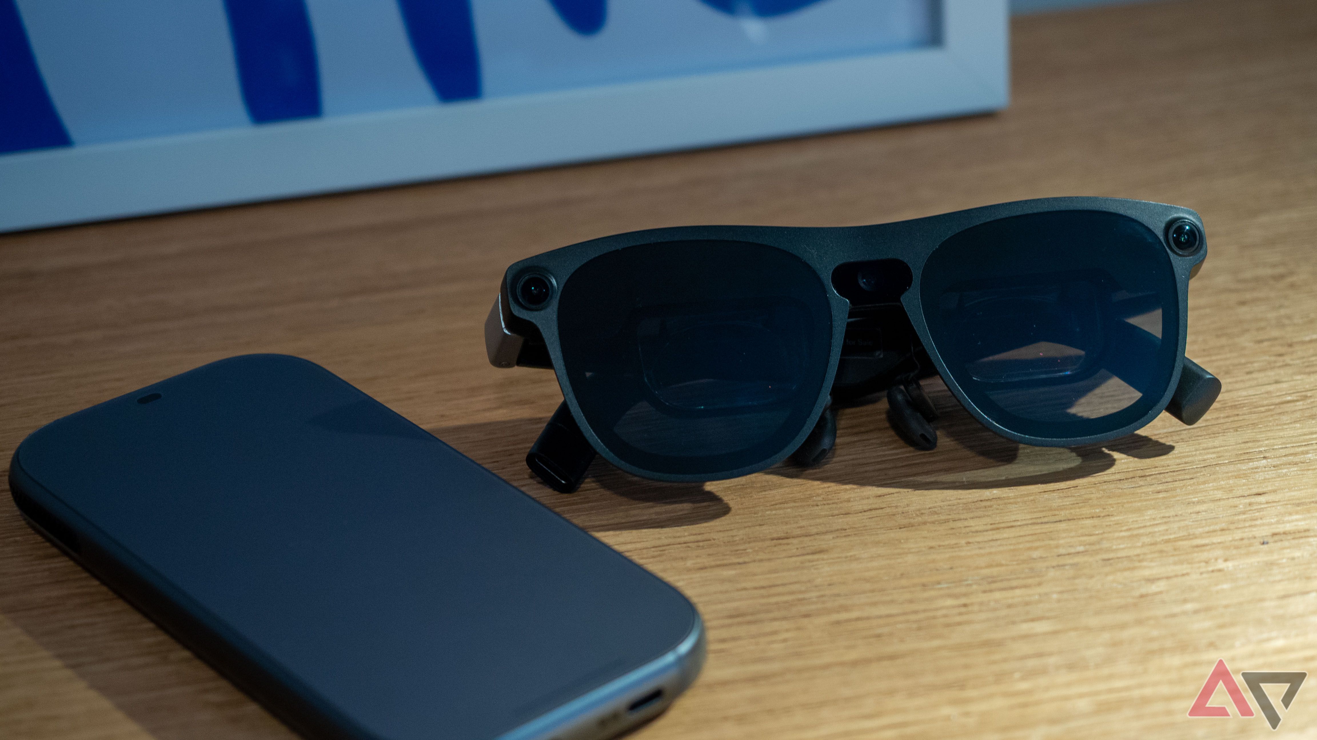 Xreal Aura glasses sitting next to the main unit