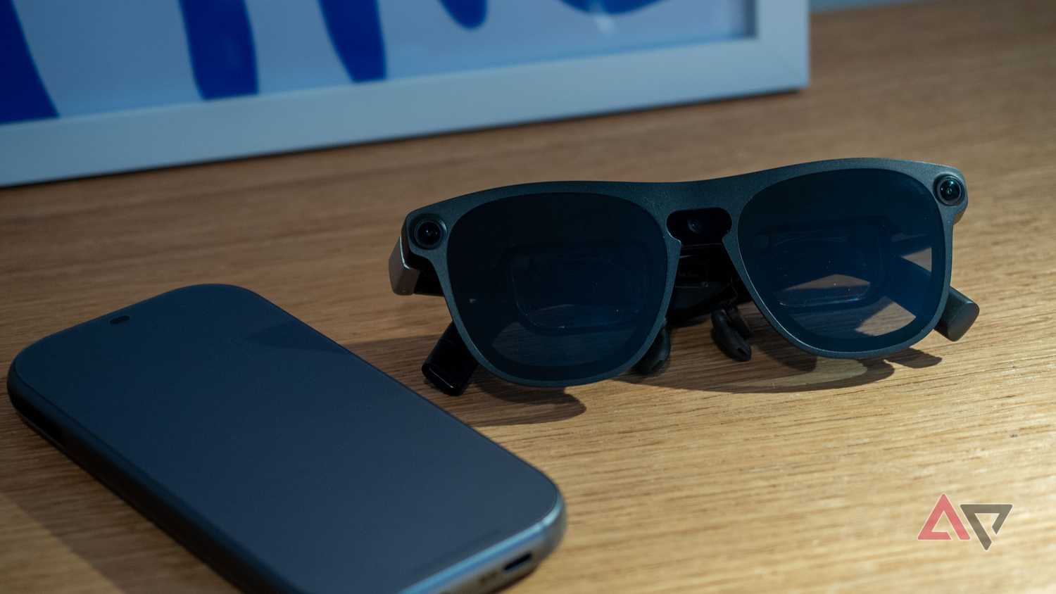 Xreal Aura glasses sitting next to the main unit