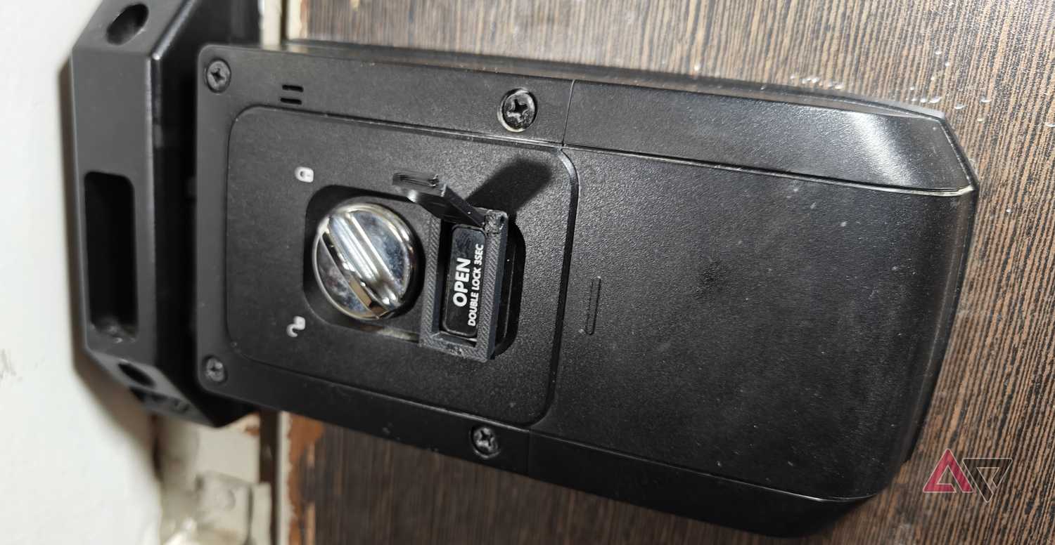 Photo showing the 3D-printed door lock cover open