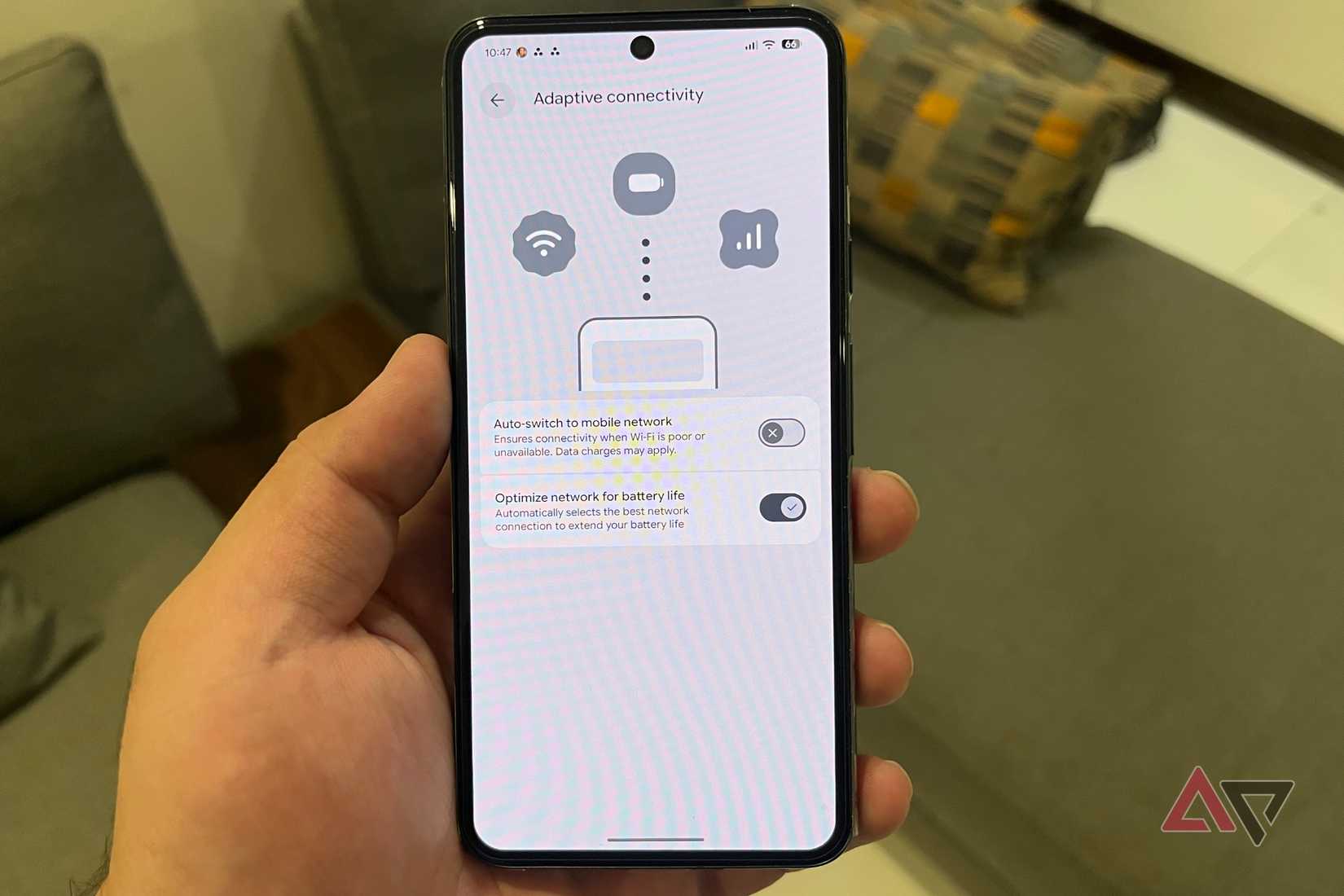 Hand holding a Pixel phone with Gemini fixes for issues
