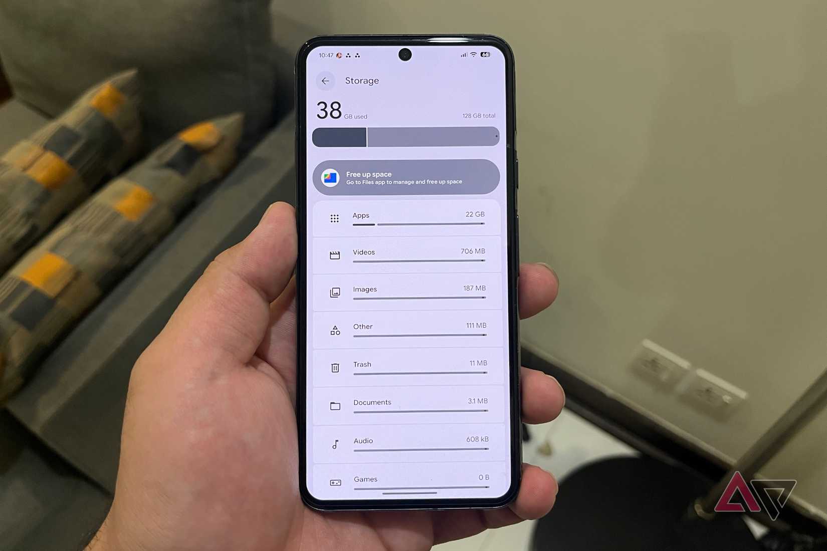 Hand holding a Pixel phone with Gemini fixes for issues
