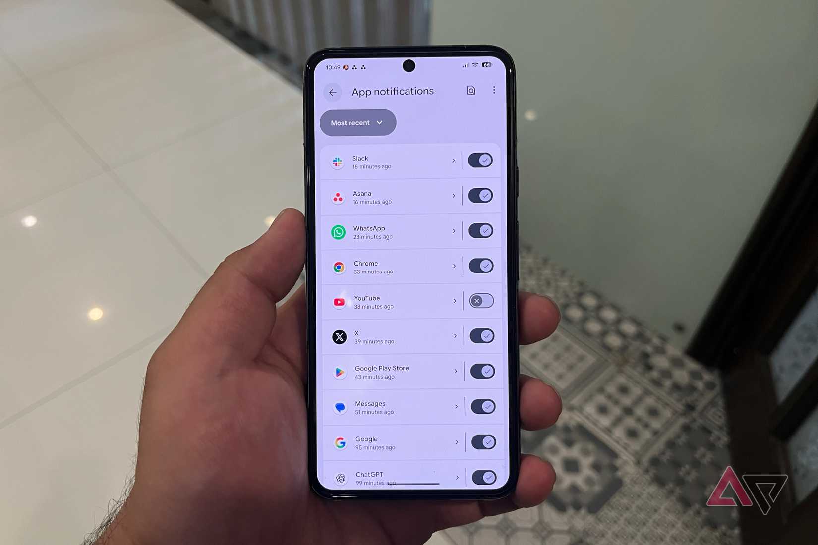 Hand holding a Pixel phone with Gemini fixes for issues