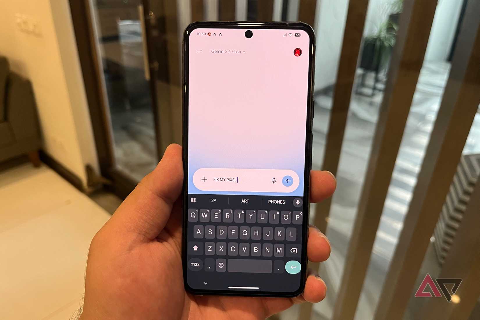 Hand holding a Pixel phone with Gemini fixes for issues