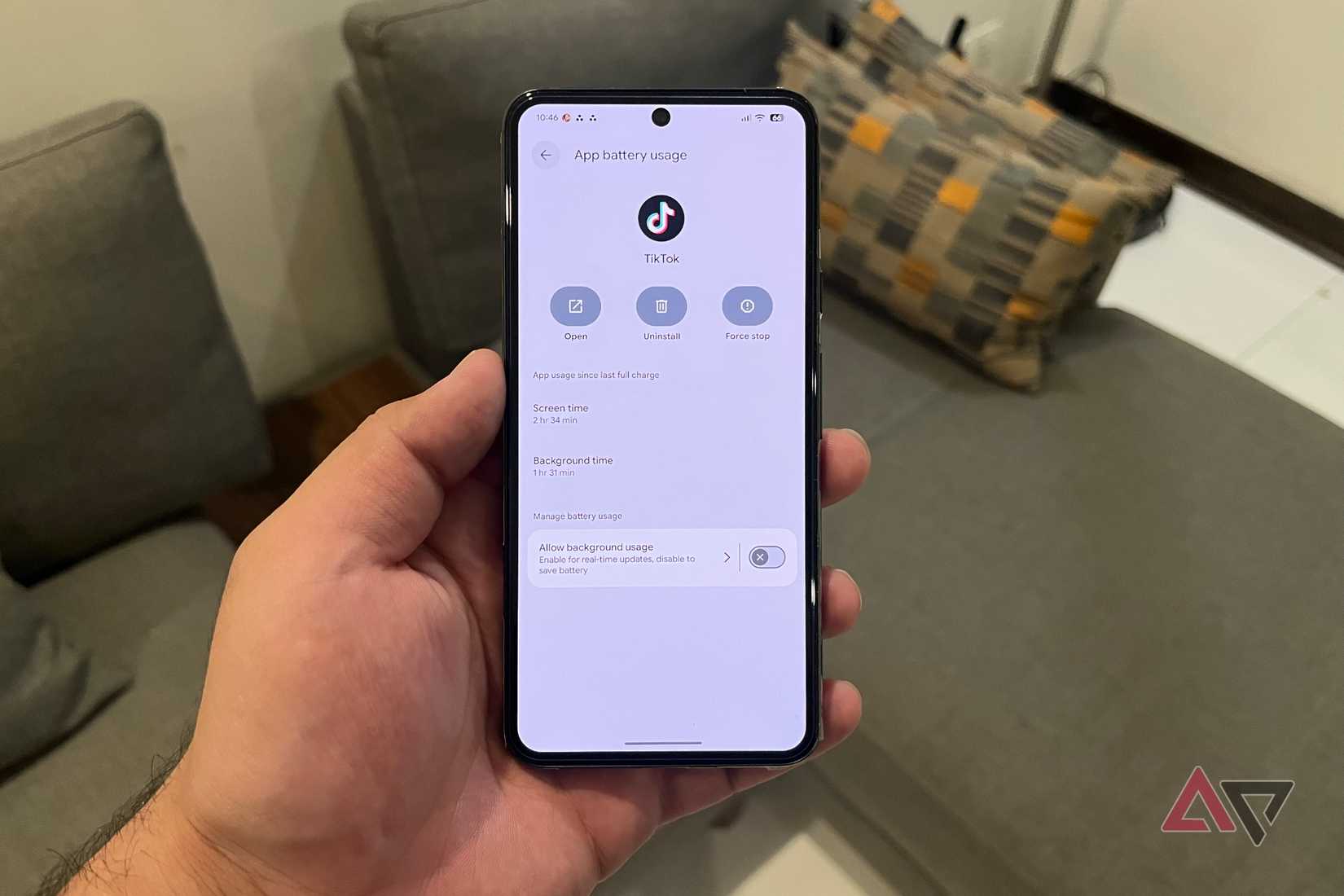Hand holding a Pixel phone with Gemini fixes for issues