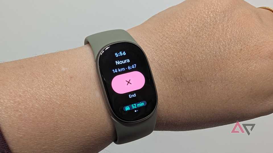 Google Fitbit Edge on a wrist showing Google Maps ongoing navigation