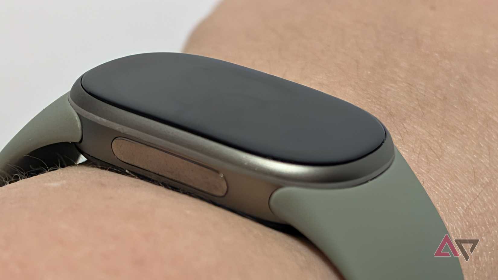 Google Fitbit Edge on a wrist, seen from the side