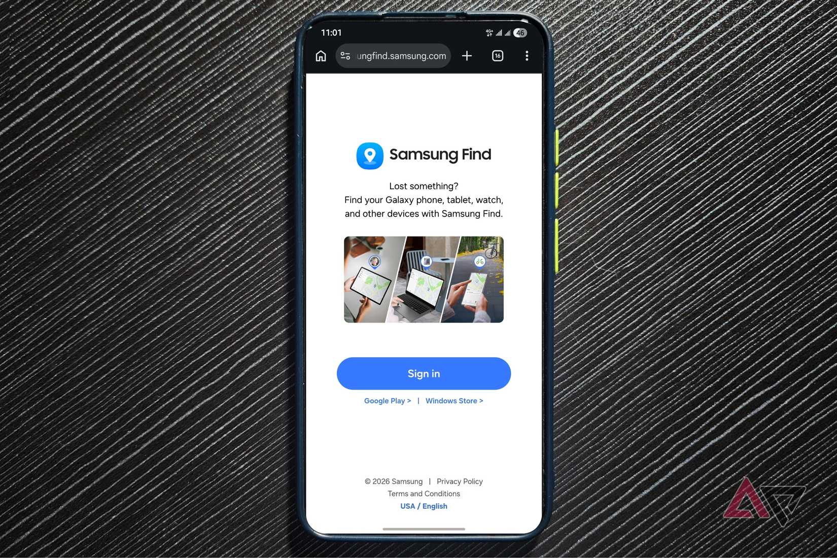 Samsung Galaxy phone on a dark textured surface showing the Samsung Find sign in page in a browser
