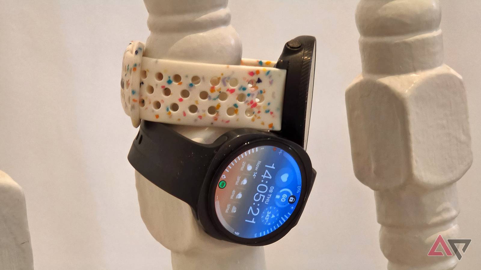 The Samsung Galaxy Watch 9 and Polar Vantage M2 on a bannister.